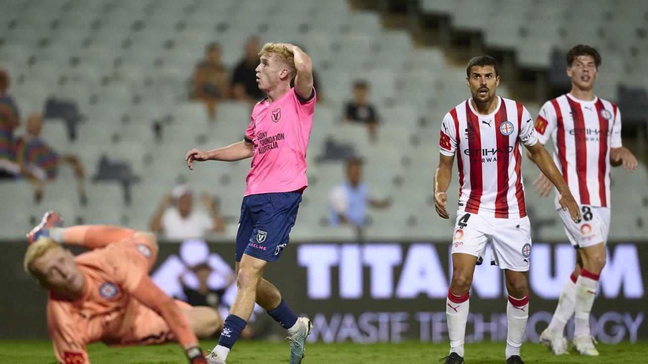 Macarthur FC’s Jed Drew (second from left) reacts during his side’s draw with Melbourne City. Picture: Brett Hemmings/Getty Images