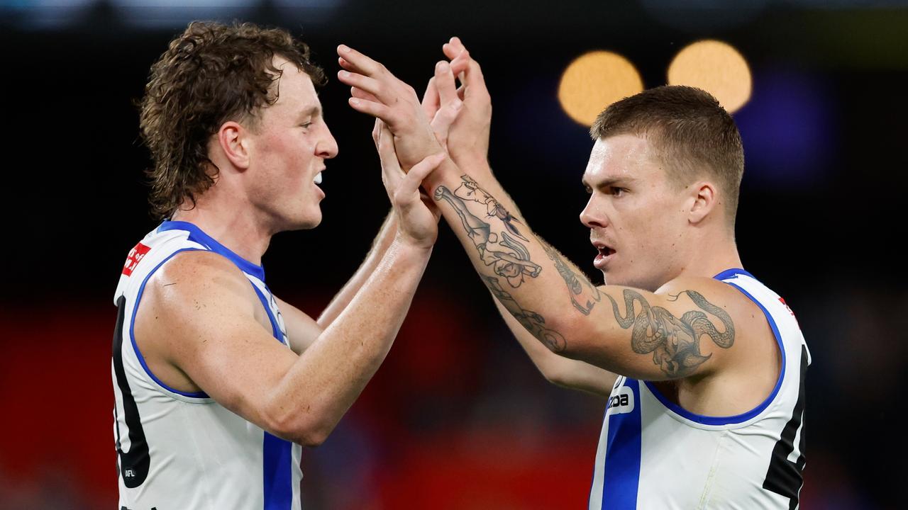 MELBOURNE, AUSTRALIA - MARCH 23: Cameron Zurhaar of the Kangaroos (R) celebrates a goal with teammate Nick Larkey during the 2024 AFL Round 2 match between the North Melbourne Kangaroos and the Fremantle Dockers on March 23, 2024 in Melbourne, Australia. (Photo by Dylan Burns/AFL Photos via Getty Images)