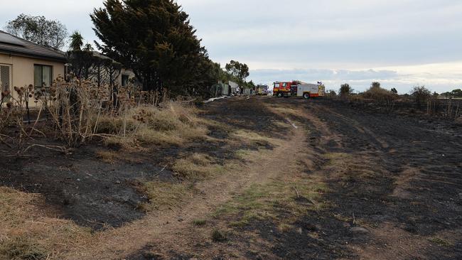 The fire damaged land and came close to properties behind Rowell Place in Taylors Lakes. Picture: Josie Hayden