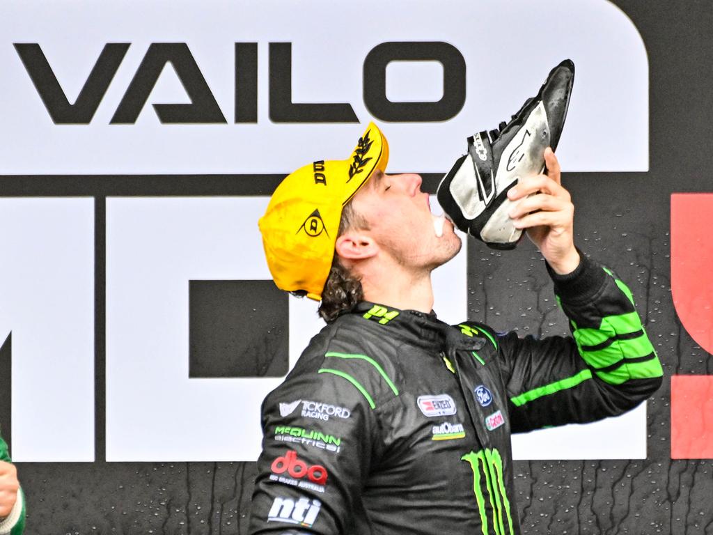 Race winner Cam Waters does a shoey. Picture: Brenton Edwards
