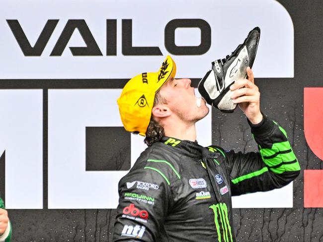 Race winner Cam Waters does a shoey. Picture: Brenton Edwards