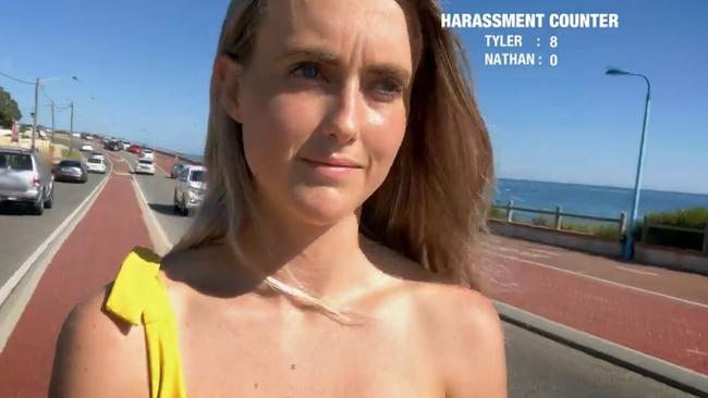 Tyler stood on a traffic island taking selfies for the SBS documentary. A tally of street harassment, compared to a man doing the same, is shown on screen. Picture: SBS