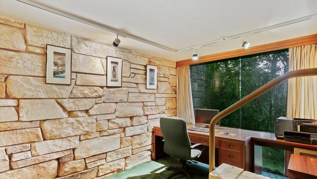 Stone walls are a recurring feature in the home.