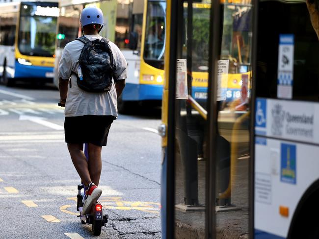 People riding escooters to go with a report about injuries sustained while riding them. Brisbane CBD Wednesday 3rd April 2024 Picture David Clark