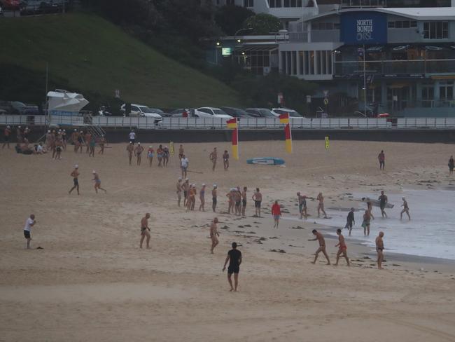 Beachgoers braved the stormy weather in Sydney on Wednesday. Picture: John Grainger