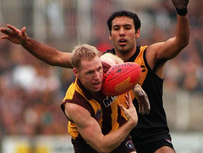 Andy Collins marking for the Hawks in 1996.