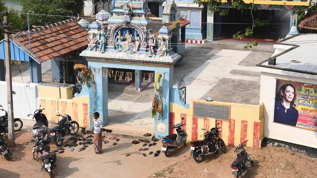 A poster of Kamala Harris on a temple in Thulasendrapuram, India, the home of her grandfather. Picture: AFP