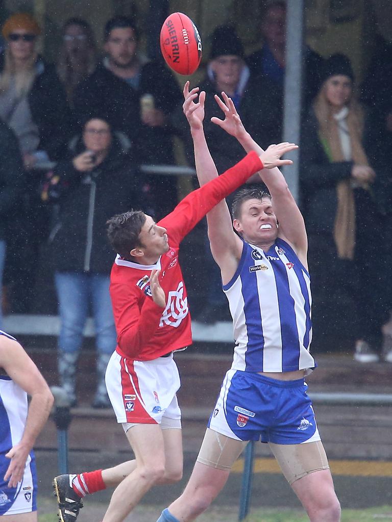 A mark slips through the hands due to slippery conditions. Picture: Glenn Ferguson.