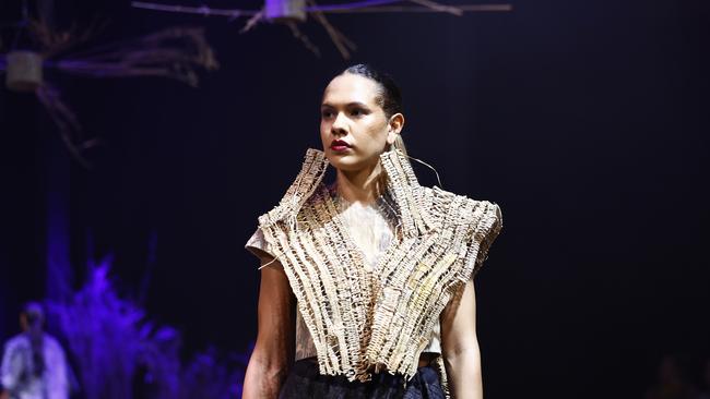 Sarah Eggmolesse wears a Delvene Cockatoo-Collins design at the Cairns Indigenous Art Fair fashion performance, Woven, held at the Tanks Arts Centre, Edge Hill. Picture: Brendan Radke