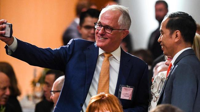 Former prime minister Malcolm Turnbull takes a selfie with Indonesia’s President Joko Widodo at an official lunch at Parliament House in Canberra on Monday. Picture: AAP