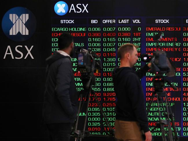 SYDNEY, AUSTRALIA - AUGUST 06: TV camera people record electronic boards displaying stock information at the Australian Securities Exchange, operated by ASX Ltd. on August 06, 2024 in Sydney, Australia. The markets are closely attuned to the RBA's next rates decision, with inflation persisting even as rates have been elevated for an extended time after the end of the COVI-19 pandemic. (Photo by Lisa Maree Williams/Getty Images)