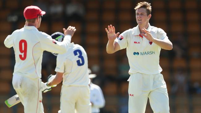 Joe Mennie celebrates one of his wickets against the Blues. Picture: Mark Metcalfe/Getty Images