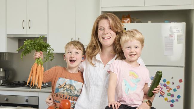 Elisha Lehmann, 5, with mum Naomi Lehmann and Isla May Lehmann, 3, at home in Clovelly Park. Picture: Matt Loxton