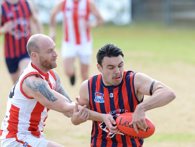 Mordialloc #33 Alisdair Jackson and East Malvern #19 Alex Hywood contest a loose ball. Picture: AAP/ Chris Eastman