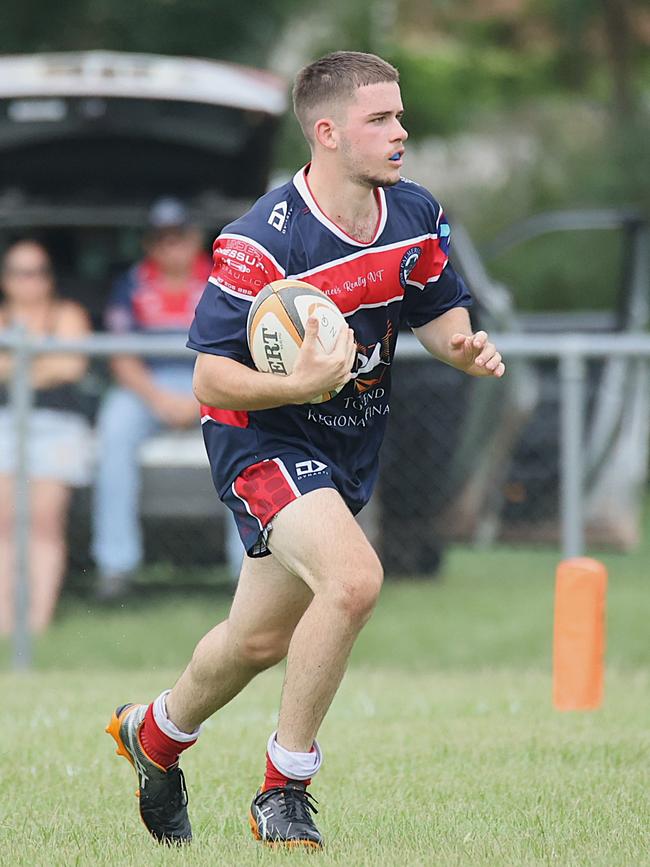 Hamish making a run during his first grade rugby match with his grandfather Dennis Bree. Picture: From The Sideline Sports Photography