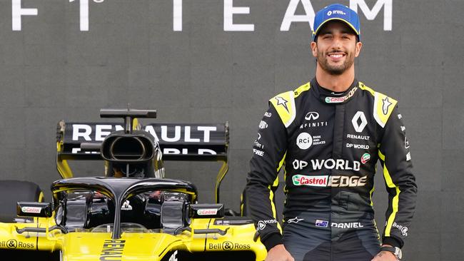 Daniel Ricciardo posed with his Renault Formula One car before being whisked away