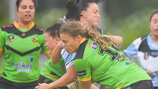 Palmerston defenders deliver a massive tackle against Sharks’ captain Ayesha Kay. Picture: Pema Tamang Pakhrin