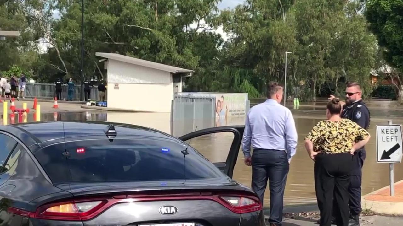 Three people, including a teenage girl and a hero cop have been rescued from floodwaters in Dalby. Picture: Anthony Gerard