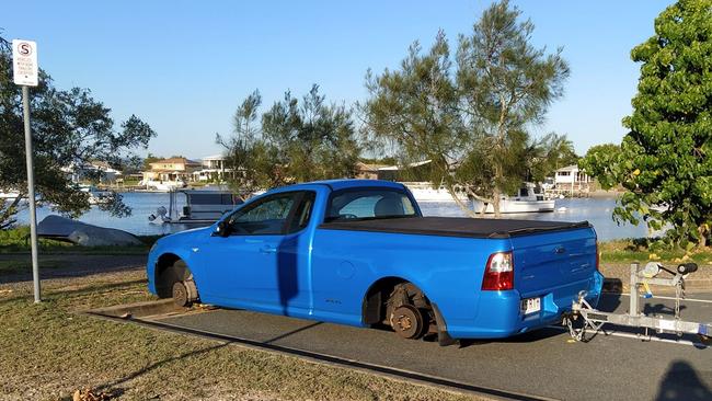 Police are investigating after a blue Ford XR6 ute was stripped of four tyres and wheels while parked at Paradise Point boat ramp. Picture: Facebook