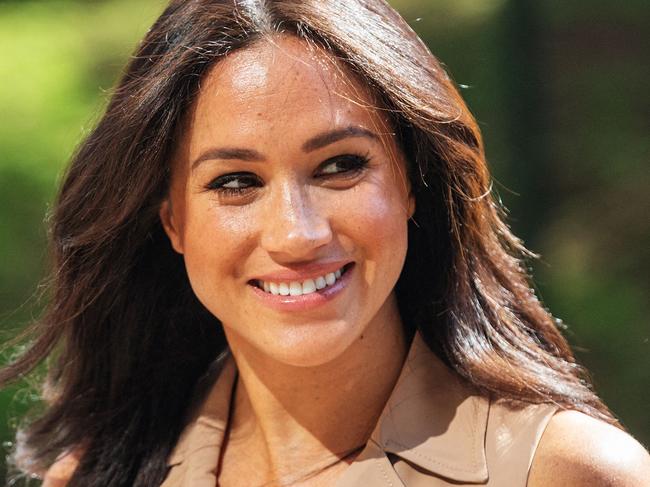 (FILES) In this file photo taken on October 01, 2019 Meghan Markle, the Duchess of Sussex arrives at the University of Johannesburg, South Africa. - Meghan Markle is to release a children's book titled "The Bench" inspired by her husband Prince Harry's bond with their son Archie, the couple's foundation announced May 4, 2021. (Photo by Michele Spatari / AFP)