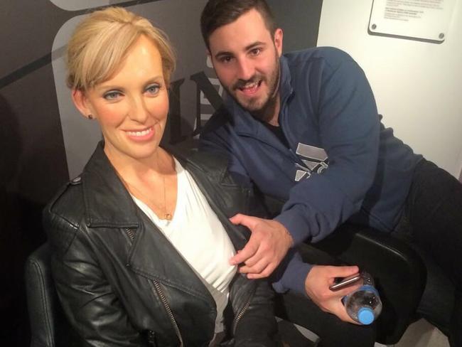 Sacked candidate Rhys Adams pretending to grope a wax model of Toni Collette.