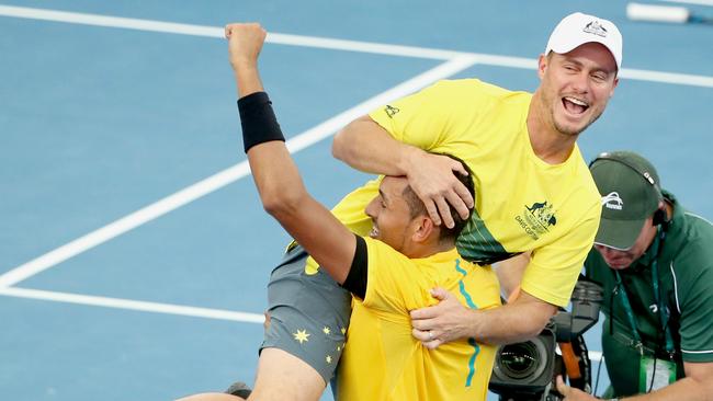 Kyrgios and Hewitt celebrate a win at Pat Rafter arena. Picture: Jono Searle