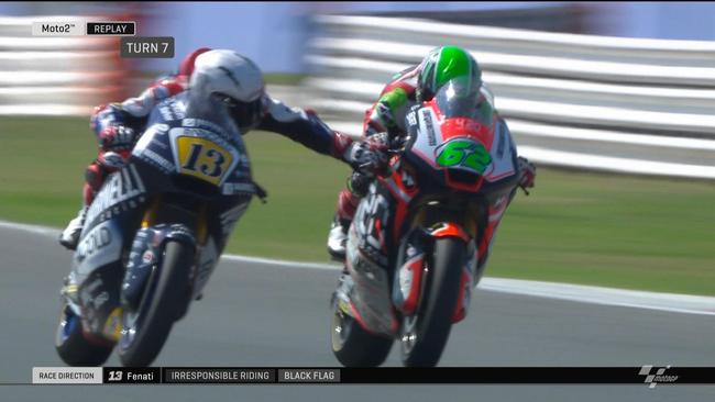 Moto2: Romano Fenati grabs the brake lever of rival Stefano Manzi mid-race.