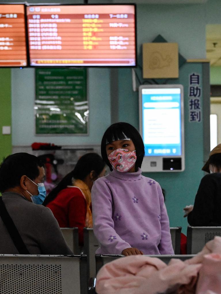 China has reported an increase in "influenza-like illness" since mid-October when compared to the same period in the previous three years, the WHO said. (Photo by Jade Gao / AFP)