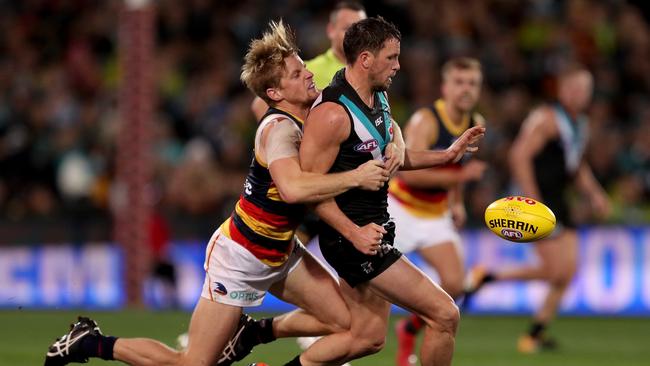 Rory Sloane stops Travis Boak in his tracks at Adelaide Oval. Picture: James Elsby/AFL Photos/Getty Images