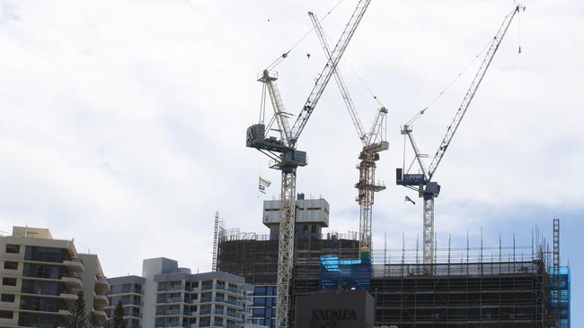 High-rise development, towers and cranes dominate the Main Beach skyline over the Norfolk Pines. Picture Glenn Hampson