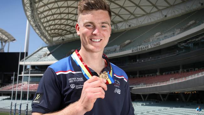 Harry Grant shows off his 2023 Magarey Medal at Adelaide Oval on Tuesday. Picture: Dean Martin.