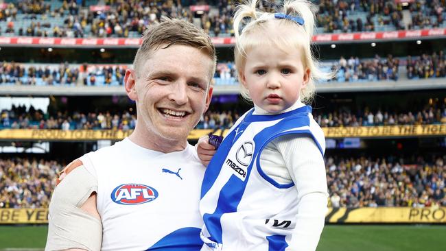 Retired Kangaroos star Jack Ziebell of the Kangaroos with daughter Pippa after his final match, hours before he was randomly attack outside a South Yarra bar. Picture: Getty Images