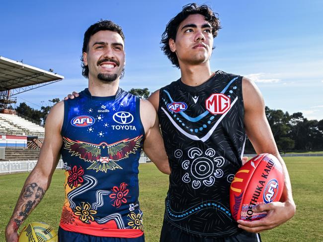 ADELAIDE, AUSTRALIA - MAY 13:  Izak Rankine of the Crows and    Jase Burgoyne of the Power pose in their Indigenous guernseys during the 2024 Sir Doug Nicholls Round Launch at Central Districts Football Club on May 13, 2024 in Adelaide, Australia. (Photo by Mark Brake/AFL Photos/via Getty Images)