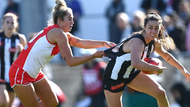 Chloe Molloy tries to evade a tackle against Sydney, one of the AFLW’s four new teams.