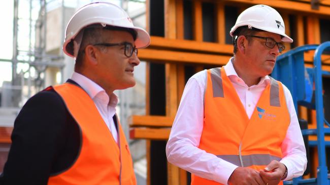 Victorian Premier Daniel Andrews (centre) and Minister for Mental Health James Merlino (left) tour the construction for a 22 bed mental health facility at the Royal Melbourne Hospital in Melbourne, Thursday, December 2, 2021. Premier Daniel Andrews and Minister for Mental Health James Merlino have marked the beginning of construction for a new mental health facility a the Royal Melbourne Hospital following a recommendation of the Royal Commission into Victoria's Mental Health System. (AAP Image/James Ross) NO ARCHIVING