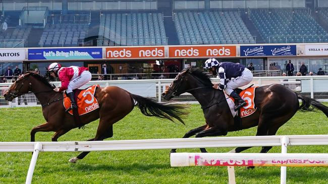 Arcadia Queen, ridden by William Pike, takes out the Ned Stakes at Caulfield.