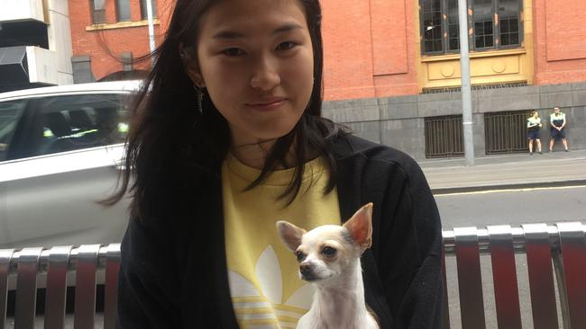 Seven-hour wait: Nina Xiao and her pet chihuahua. Picture: Supplied