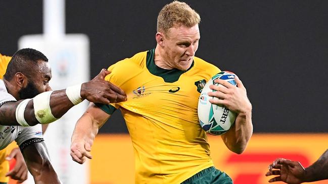 Australia's wing Reece Hodge is tackled during the Japan 2019 Rugby World Cup Pool D match between Australia and Fiji at the Sapporo Dome in Sapporo on September 21, 2019. (Photo by WILLIAM WEST / AFP)