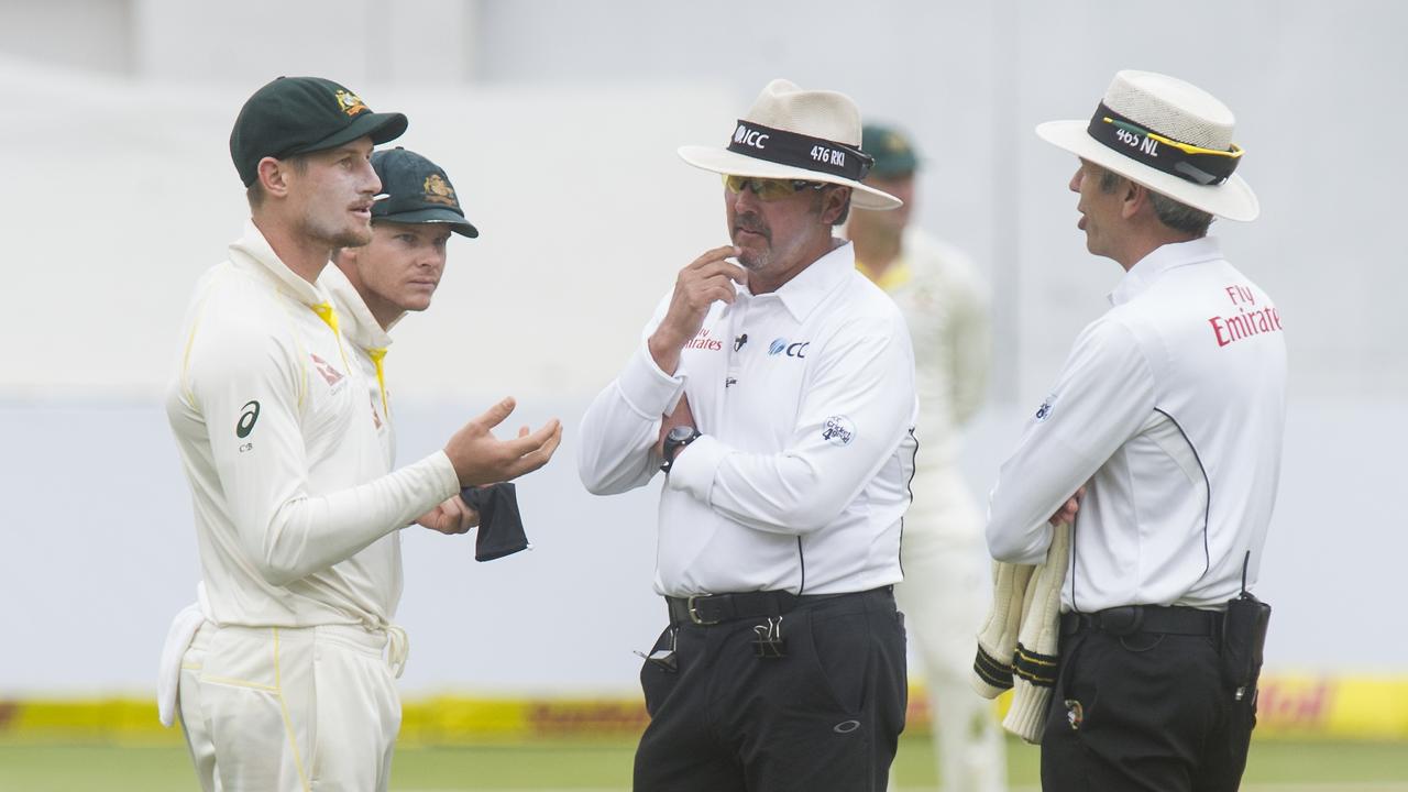 Cameron Bancroft talks with umpires Nigel Llong and Richard Illingworth during the infamous ball-tampering Newlands third-Test in 2018. Photo: Getty Images