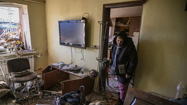 A woman stands inside her destroyed apartment after shelling in Kyiv. Picture: AFP.