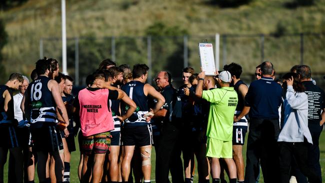 Noarlunga coach Barry Pilmore in middle of the huddle last season. Picture: AAP/Morgan Sette