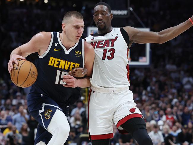 DENVER, COLORADO - JUNE 04: Nikola Jokic #15 of the Denver Nuggets dribbles against Bam Adebayo #13 of the Miami Heat during the third quarter in Game Two of the 2023 NBA Finals at Ball Arena on June 04, 2023 in Denver, Colorado. NOTE TO USER: User expressly acknowledges and agrees that, by downloading and or using this photograph, User is consenting to the terms and conditions of the Getty Images License Agreement. (Photo by Matthew Stockman/Getty Images)