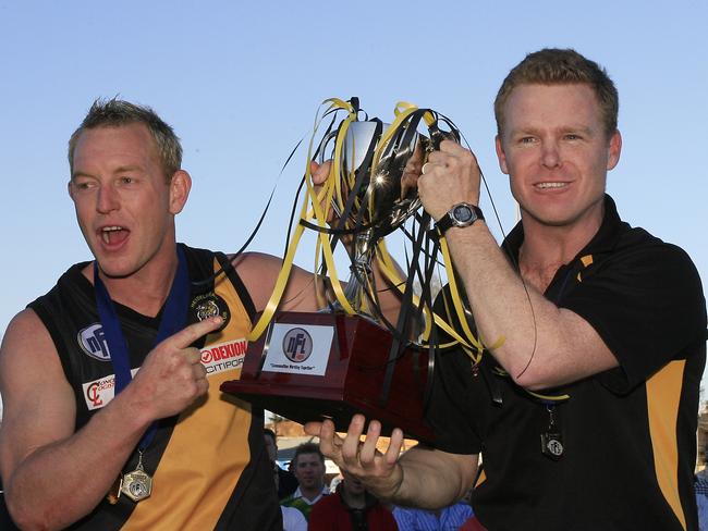 Heidelberg skipper Blair Harvey savours premiership success with coach Phil Plunkett.