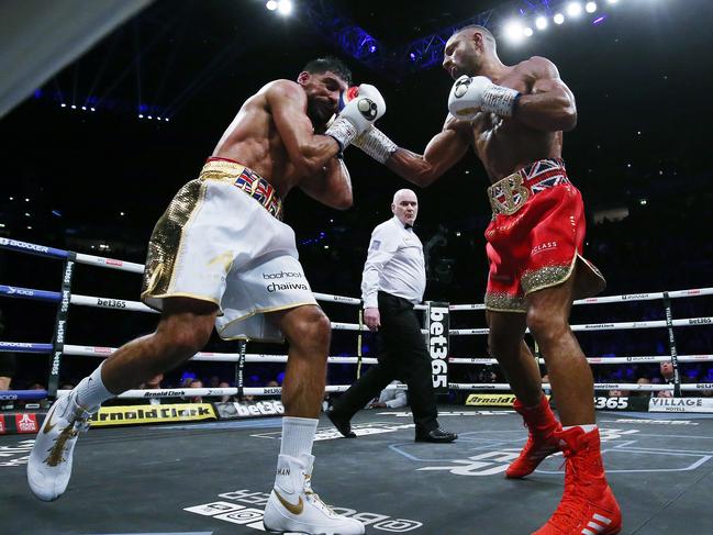 MANCHESTER, ENGLAND - FEBRUARY 19: Kell Brook (right) punches Amir Khan during their Welterweight contest at AO Arena on February 19, 2022 in Manchester, England. (Photo by Nigel Roddis/Getty Images)