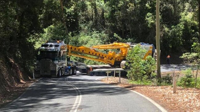 An excavator which was trapped Beechmont Road, Lower Beechmont several months ago. Photo: Facebook - Better Roads for Beechmont