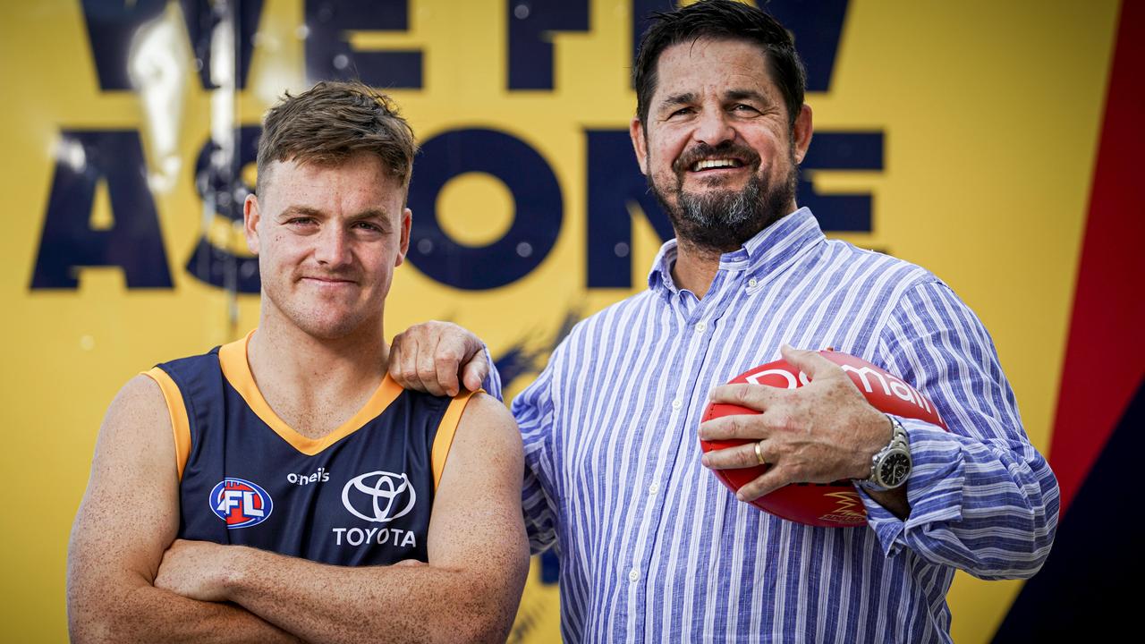 Crows draftee James Rowe with his very proud dad, former Crows star Stephen Rowe. Picture: Mike Burton