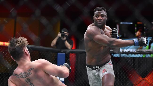 LAS VEGAS, NEVADA - MARCH 27: (R-L) Francis Ngannou of Cameroon drops Stipe Miocic in their UFC heavyweight championship fight during the UFC 260 event at UFC APEX on March 27, 2021 in Las Vegas, Nevada. (Photo by Chris Unger/Zuffa LLC)