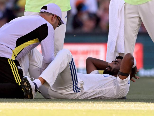 India’s Jasprit Bumrah receives treatment to his leg – but was it cramp, or something more severe? Picture: Getty