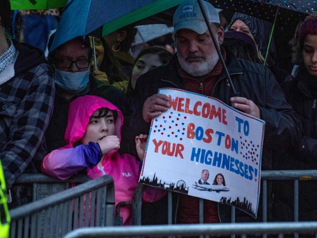 Hundreds of fans waited in the rain in Boston, Massachusetts, some holding signs. Picture: AFP.