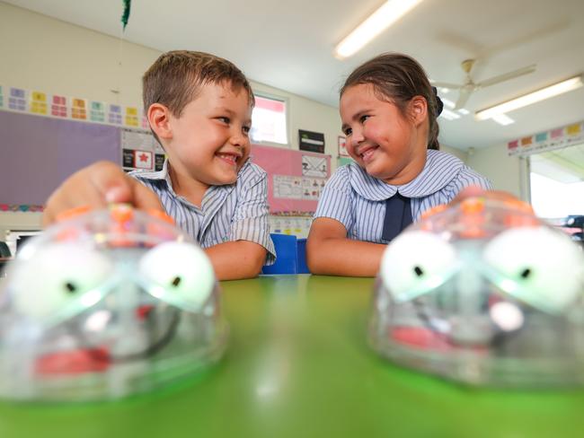 St Francis College Creastmead teacher Ella Richards with students Jamieson Norton, 5 (left) and Aria Norton, 6, are using AI in school.Photo by Pete Wallis